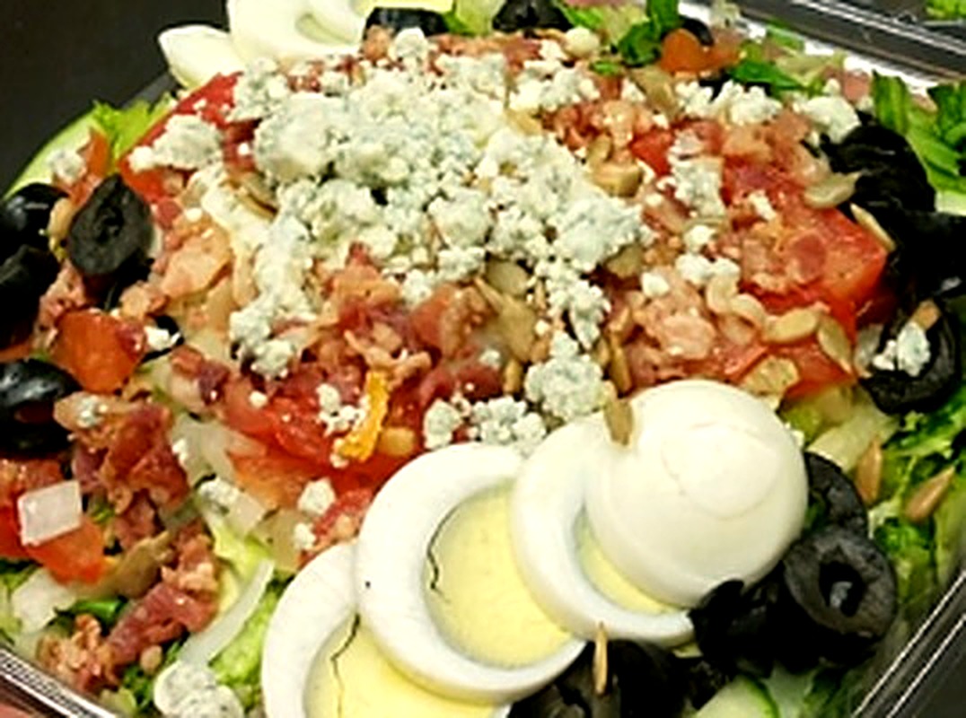 Loaded chopped salad with blue cheese and egg