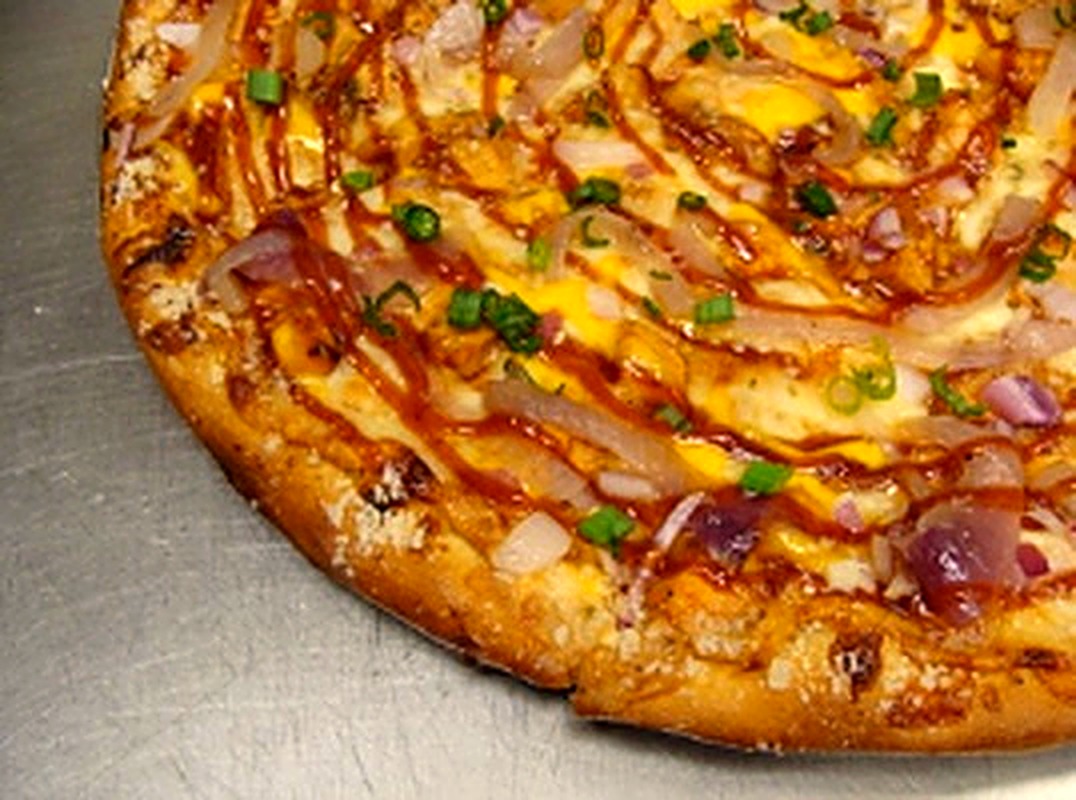 BBQ chicken pizza with red onion and scallions