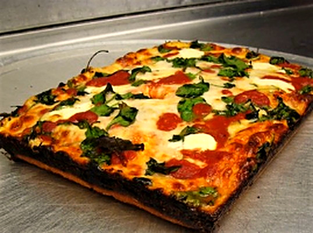 Deep-dish spinach and pepperoni pizza